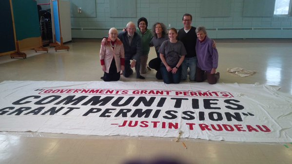 Group photo with large banner